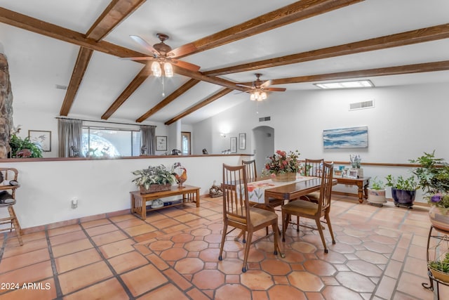 tiled dining space featuring ceiling fan and vaulted ceiling with beams