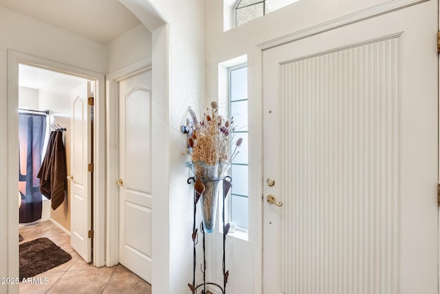 entrance foyer with light tile patterned floors