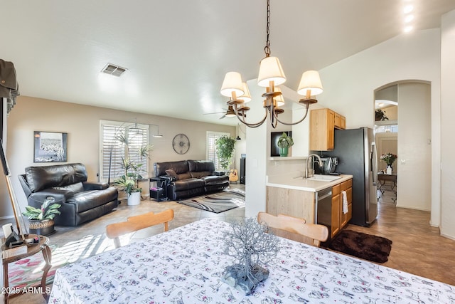 dining room with an inviting chandelier and sink