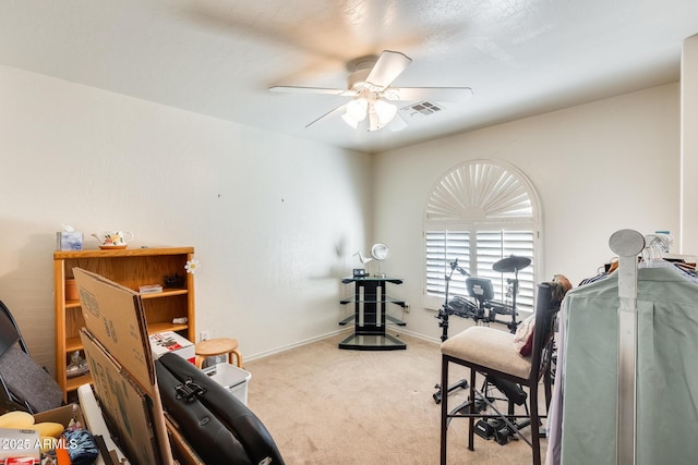 interior space with light colored carpet and ceiling fan