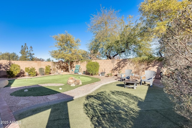 view of yard with a fire pit