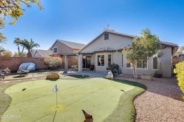 rear view of house featuring a patio