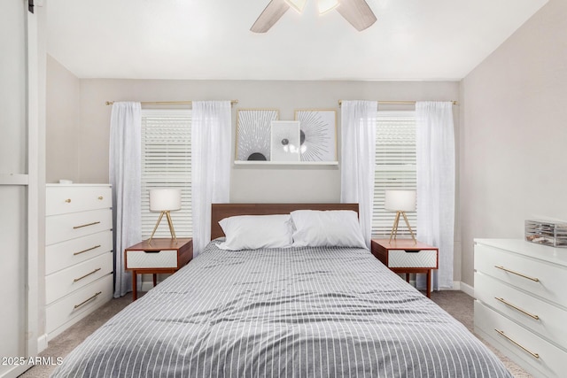 bedroom featuring ceiling fan, carpet, and baseboards