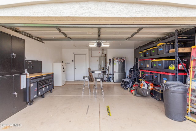 garage with freestanding refrigerator and a garage door opener