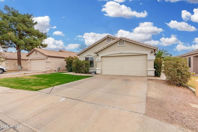 ranch-style home featuring driveway, a tile roof, an attached garage, a front lawn, and stucco siding