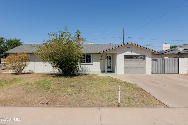 5802 N 61st Dr, Glendale, AZ 85301 - view of front of home featuring an attached garage, concrete driveway, and roof with shingles
