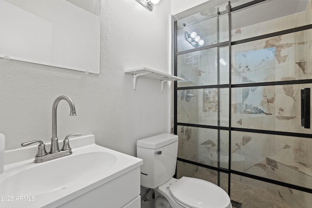 5802 N 61st Dr, Glendale, AZ 85301 - full bath featuring a shower stall, a textured wall, toilet, and vanity