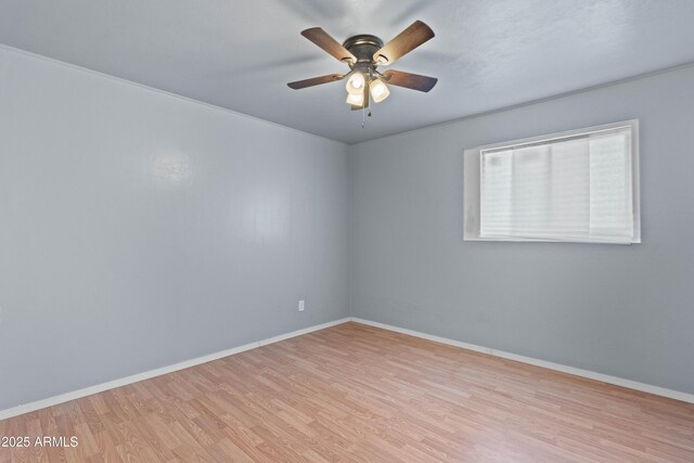 5802 N 61st Dr, Glendale, AZ 85301 - empty room with wood finished floors, baseboards, and ceiling fan
