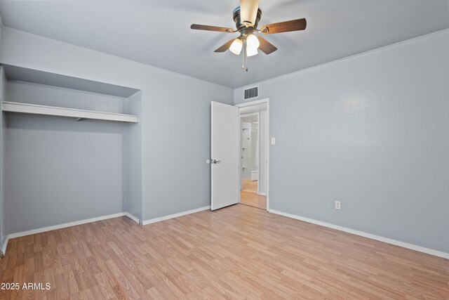 5802 N 61st Dr, Glendale, AZ 85301 - unfurnished bedroom featuring wood finished floors, baseboards, and a closet