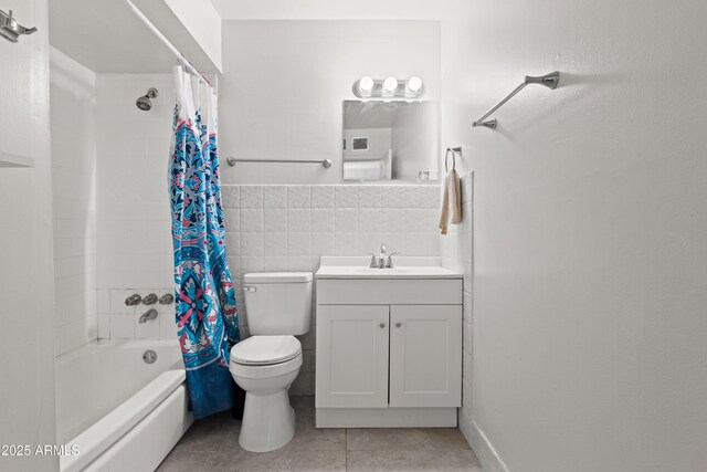 5802 N 61st Dr, Glendale, AZ 85301 - full bathroom with tile patterned flooring, tile walls, shower / tub combo, toilet, and vanity