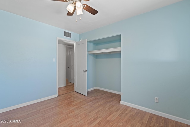 5802 N 61st Dr, Glendale, AZ 85301 - unfurnished bedroom featuring a closet, light wood finished floors, baseboards, and ceiling fan