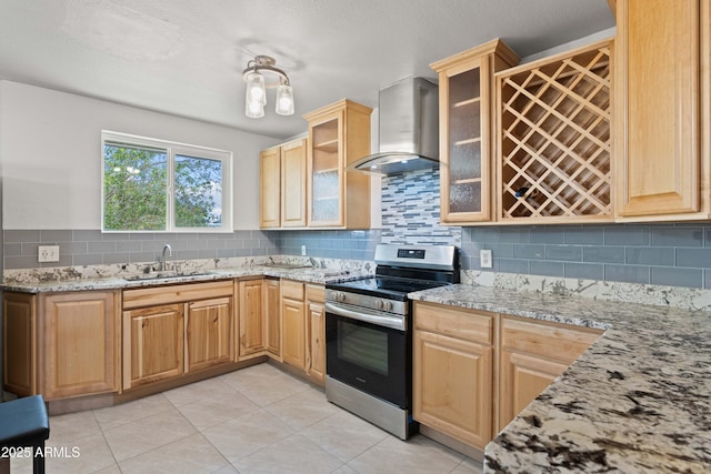 5802 N 61st Dr, Glendale, AZ 85301 - kitchen featuring stainless steel electric stove, wall chimney range hood, a sink, backsplash, and light stone counters
