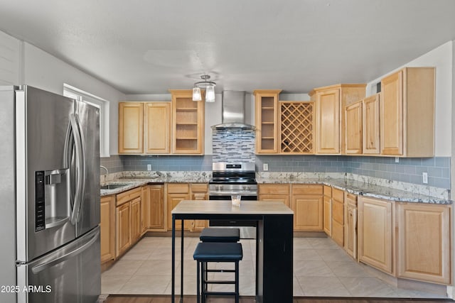 5802 N 61st Dr, Glendale, AZ 85301 - kitchen featuring stainless steel appliances, wall chimney range hood, light brown cabinets, and a sink