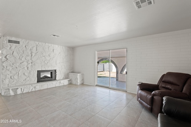 5802 N 61st Dr, Glendale, AZ 85301 - living room featuring a stone fireplace and tile patterned floors