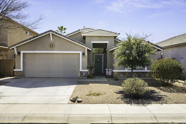 view of front of house with a garage, concrete driveway, and stucco siding