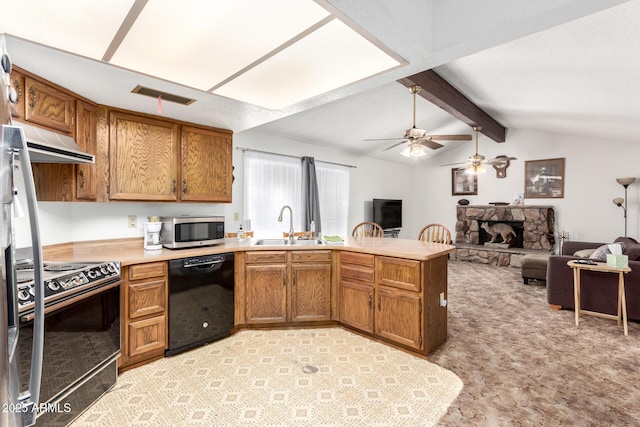 kitchen with stainless steel appliances, visible vents, light countertops, open floor plan, and under cabinet range hood