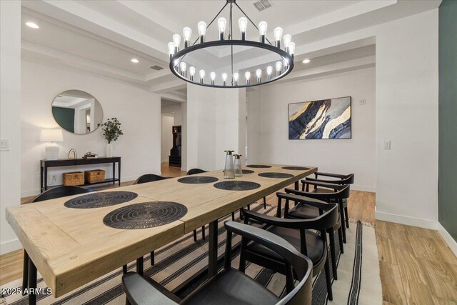 dining room featuring baseboards, recessed lighting, light wood-style flooring, and a chandelier