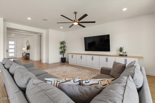 living area featuring visible vents, baseboards, ceiling fan, recessed lighting, and light wood-style flooring
