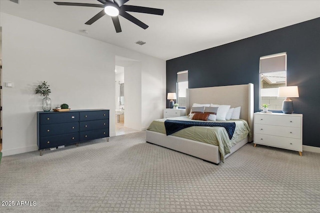 bedroom with a ceiling fan, baseboards, visible vents, and carpet