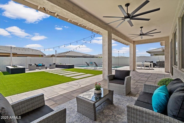 view of patio / terrace featuring an outdoor living space, a fenced backyard, and a fenced in pool