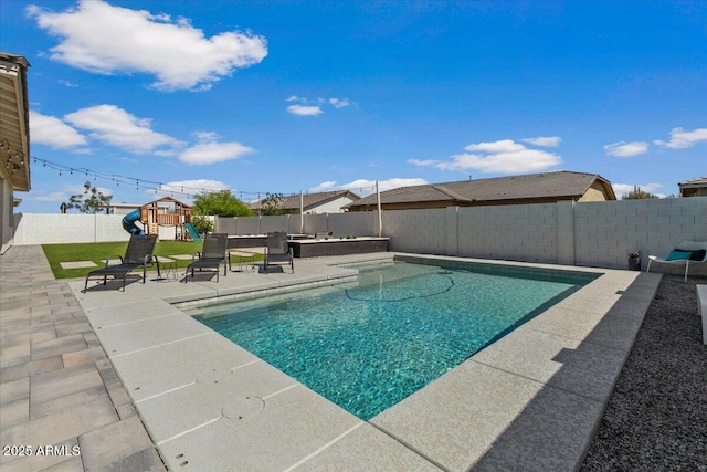 view of swimming pool featuring a patio, a fenced backyard, a playground, and a fenced in pool