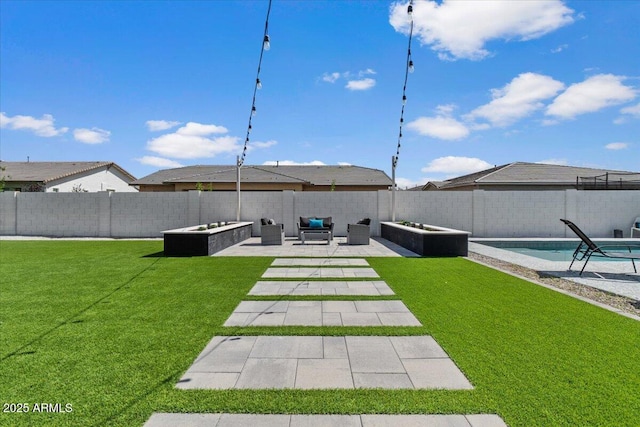 view of yard featuring a fenced backyard, a fenced in pool, a patio, and an outdoor hangout area