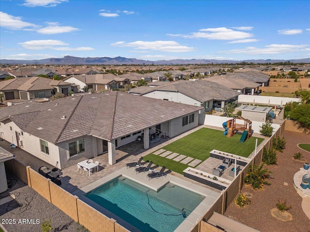 birds eye view of property featuring a mountain view and a residential view