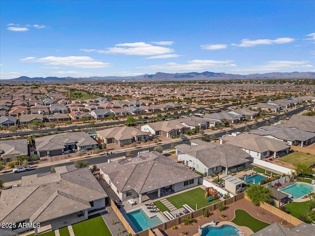 drone / aerial view with a residential view and a mountain view