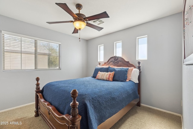 bedroom featuring a ceiling fan, carpet, visible vents, and baseboards