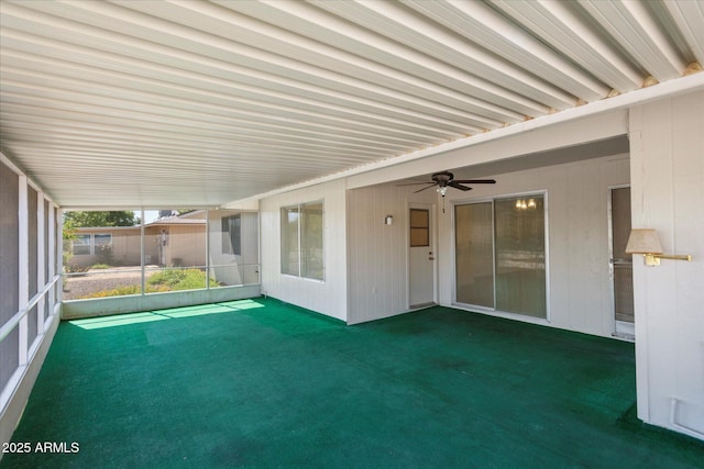 unfurnished sunroom with ceiling fan