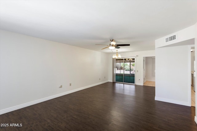 spare room with ceiling fan and dark hardwood / wood-style flooring