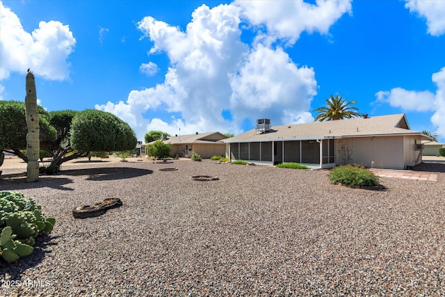 view of yard featuring a sunroom