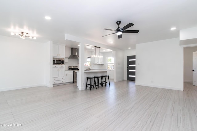 1011 W Weldon Ave, Phoenix, AZ 85013 - living area with ceiling fan, recessed lighting, and baseboards