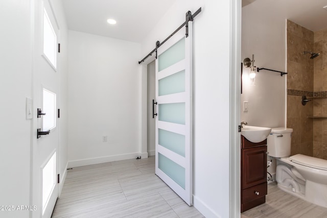 1011 W Weldon Ave, Phoenix, AZ 85013 - full bathroom with toilet, a tile shower, vanity, and baseboards