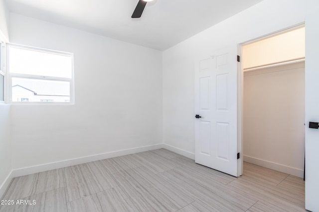 1011 W Weldon Ave, Phoenix, AZ 85013 - unfurnished bedroom featuring baseboards and a ceiling fan