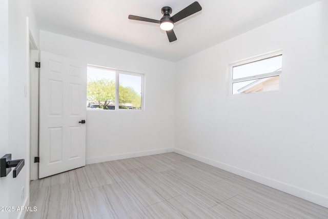 1011 W Weldon Ave, Phoenix, AZ 85013 - spare room with a ceiling fan and baseboards
