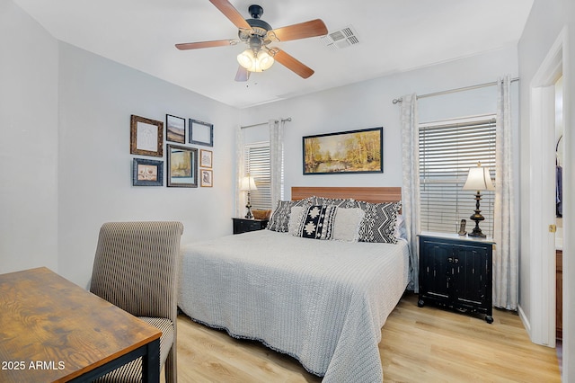 948 E Savannah Dr, Chandler, AZ 85225 - bedroom with multiple windows, light wood-type flooring, and ceiling fan