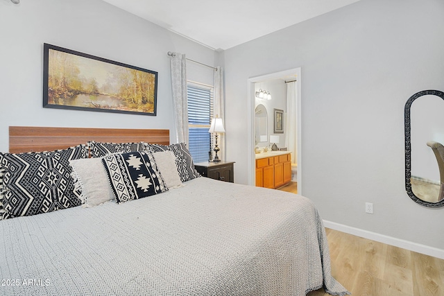 948 E Savannah Dr, Chandler, AZ 85225 - bedroom featuring light wood-style floors, baseboards, and ensuite bathroom
