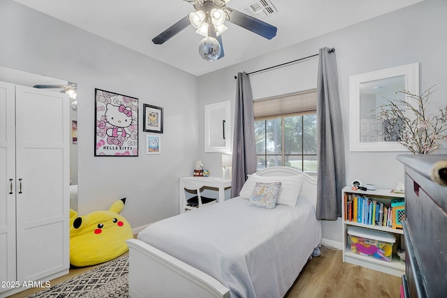 948 E Savannah Dr, Chandler, AZ 85225 - bedroom featuring wood finished floors, a ceiling fan, and baseboards