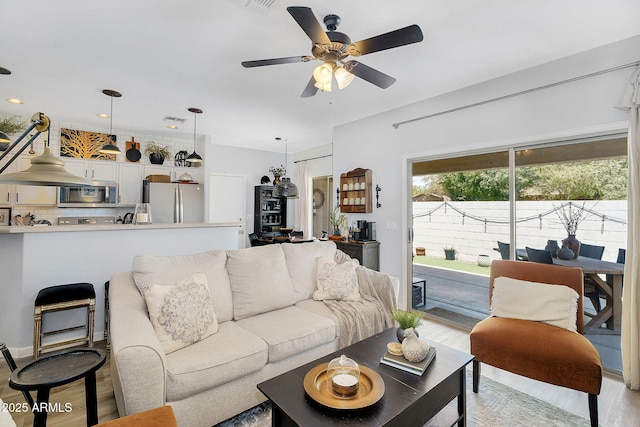 948 E Savannah Dr, Chandler, AZ 85225 - living area featuring light wood finished floors and a ceiling fan