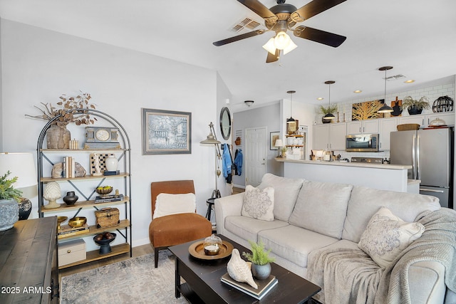 948 E Savannah Dr, Chandler, AZ 85225 - living area with a ceiling fan, light wood finished floors, recessed lighting, and baseboards