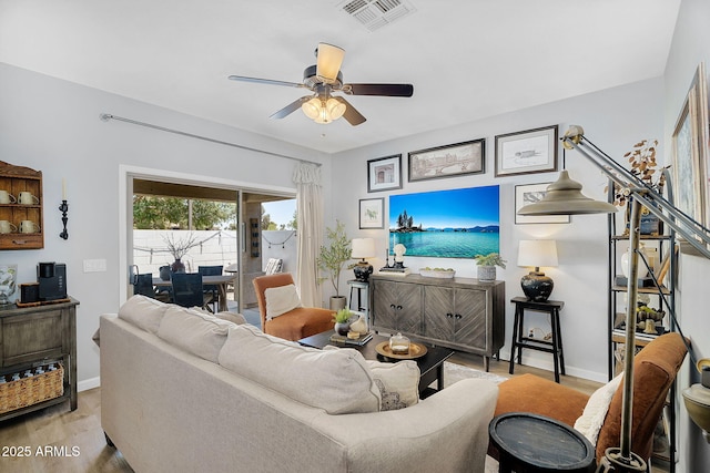 948 E Savannah Dr, Chandler, AZ 85225 - living room featuring wood finished floors, ceiling fan, and baseboards