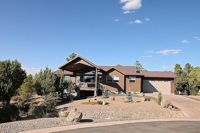 860 W Snow Creek Trl, Show Low, AZ 85901 - view of front of home with a garage, driveway, and metal roof
