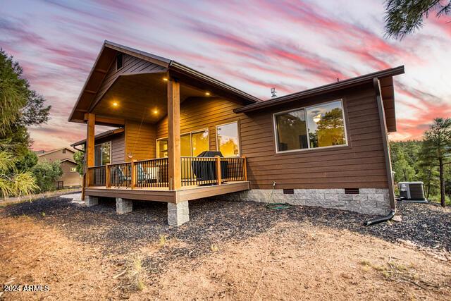 860 W Snow Creek Trl, Show Low, AZ 85901 - back of house with crawl space, a wooden deck, and central air condition unit