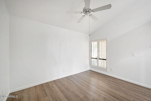 unfurnished room featuring ceiling fan, lofted ceiling, and dark hardwood / wood-style flooring