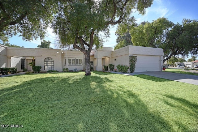 view of front of home with a garage and a front yard