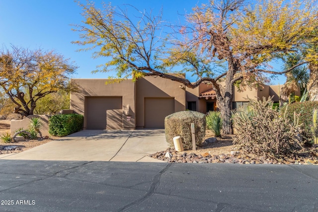 adobe home featuring a garage