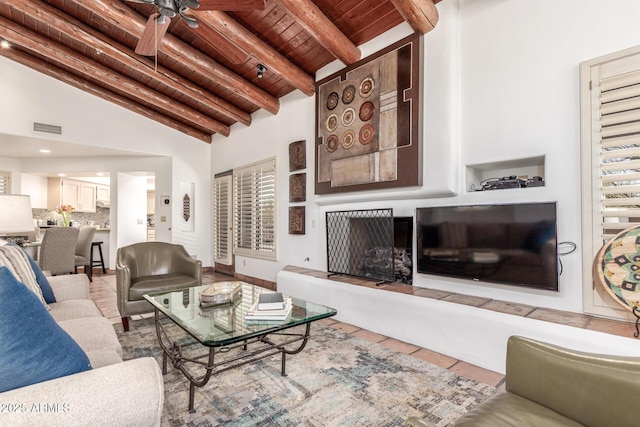 tiled living room with high vaulted ceiling, beam ceiling, wooden ceiling, and ceiling fan