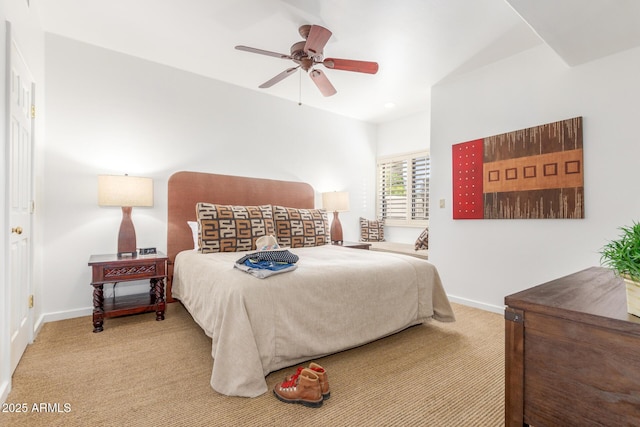 bedroom featuring ceiling fan and light carpet