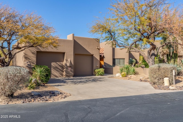 southwest-style home with a garage